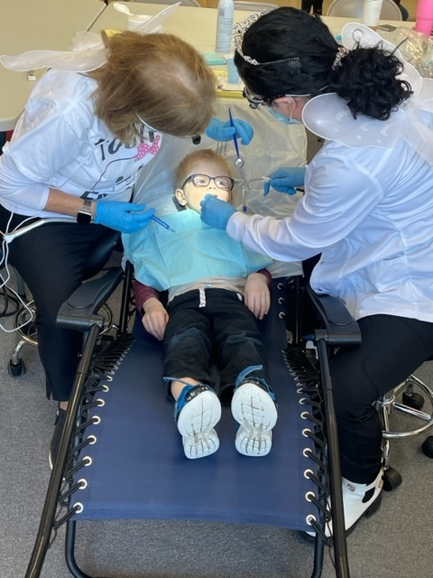 Free tooth care being provided to a student