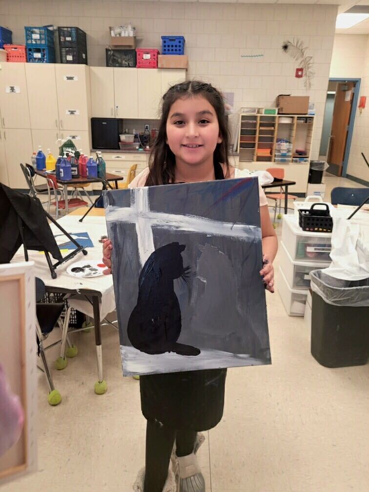 Student with painting of a cat