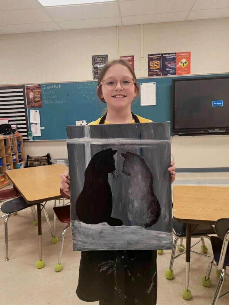 Student with painting of a cat