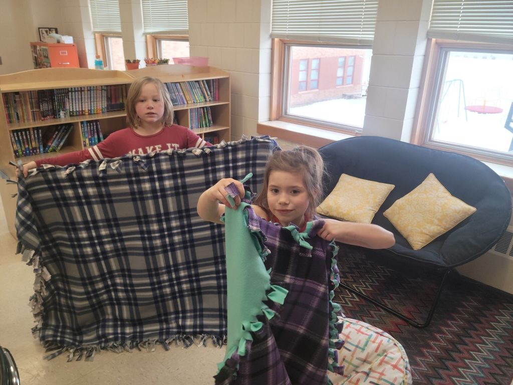 Students with quilts they made