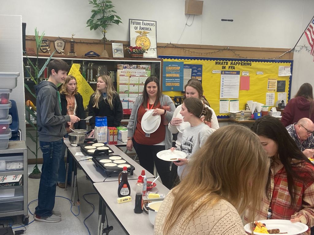 Students serving breakfast
