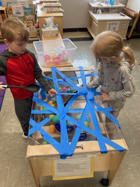 students doing an egg hunt in a maze