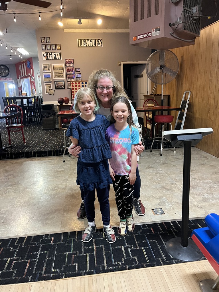 kids and teacher at bowling alley