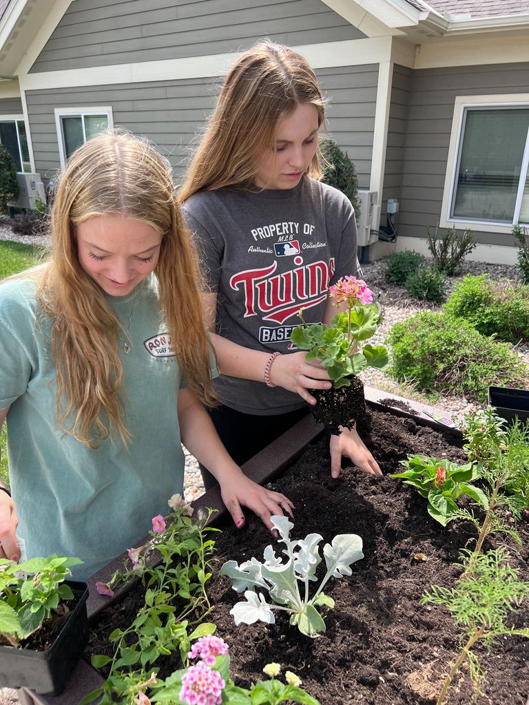 Students planting flowers